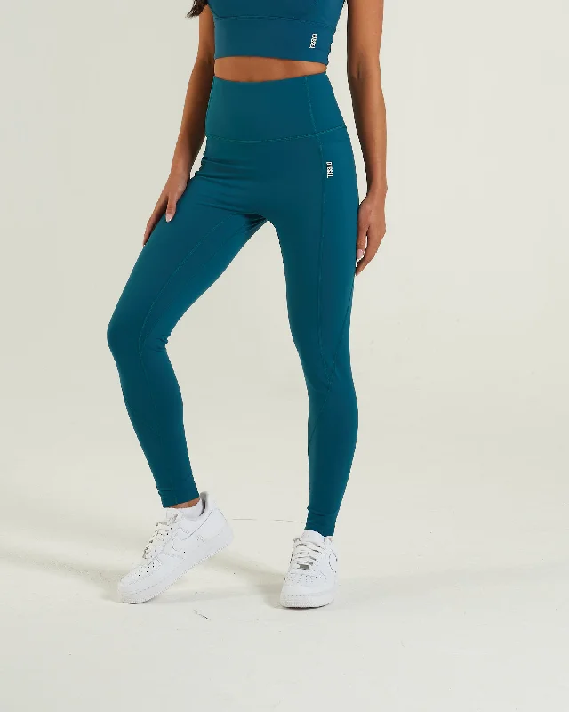 women tights for a ski vacation on the slopesStudio Active Pant Teal Green