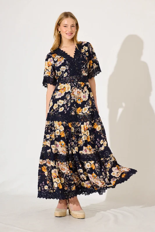 Maxi dresses with ruffled tiers for a romantic beach weddingMona Maxi Dress In Ink With Rust Floral